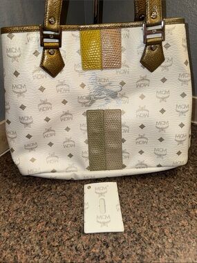 MCM RARE White lioness tote with Metallic Gold Straps and ID holder
